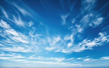 Expansive blue sky with wispy clouds and gentle breezes.