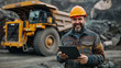 © Eugen - Worker in hard hat using tablet beside dump truck. Generative AI