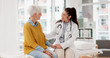© peopleimages.com - Holding hands, happy or doctor with patient in consultation for healthcare advice or checkup at hospital. Support, cancer therapy or medical worker talking to person in appointment for medicare