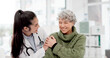 © peopleimages.com - Happy, care and face of a doctor with a woman for medical trust, healthcare and help. Laughing, hug and portrait of a young nurse with a senior patient and love during a consultation at a clinic