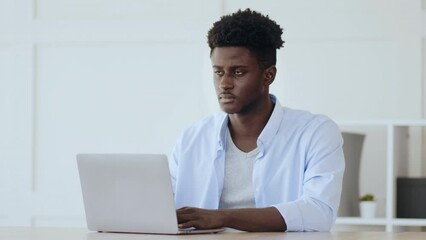Poster - Young man running content of social media network, looking for information on screen of his smartphone, closeup