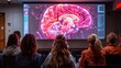 A group of people are watching a brain scan on a large screen