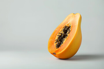 Poster - A ripe papaya isolated on a plain backdrop, revealing its orange flesh and tropical aroma. Concept of exotic fruit and island cuisine. Generative Ai.