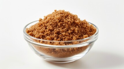 Wall Mural - Brown sugar in a clear bowl set against a white background