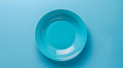 Wall Mural - Top view of isolated of colored background empty round blue plate for food Empty dish with space for your design : Generative AI