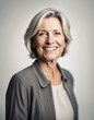 © abu - Portrait of a smiling middle-aged woman standing against white background