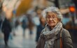 © imagineRbc - An elderly woman with gray hair is walking down the street in an urban area
