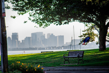 Sticker - Bench overlooking a city from a grassy field