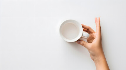 Poster - Female hand holding empty coffee cup isolated on white background with clipping path top view flat lay : Generative AI