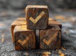 Wooden cubes with a check mark icon on a grey background, representing a concept of choice selection.