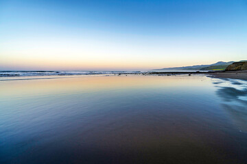 Wall Mural - Sunset, sunrise over the ocean, waves, water, reflections