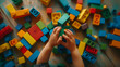 © Generative AI - Close up of child hands playing with colorful wooden bricks at the table Toddler having fun and building out of bright constructor bricks Early learning Top view Flat lay : Generative AI