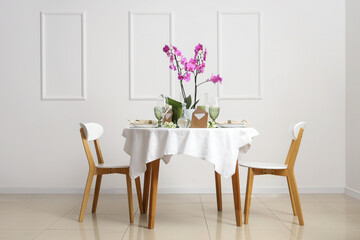 Sticker - Beautiful table setting with orchid flower for wedding celebration near light wall