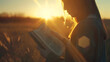 © Generative AI - girl reads bible book sunset bible hand sun book pray sunset reading bible man girl ask forgiveness from sun religious man reads book rays sunlight travel millennium with book prayer r : Generative AI