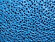 abstract blue background with foam plastic texture, close - up.