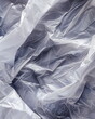 Close-up of an empty plastic bag. Texture of crumpled white plastic bag, crumpled wrapping paper. Full frame abstract background made of crumpled white plastic film