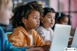 © InfiniteStudio - Multiethnic group of children using computers in a classroom.
