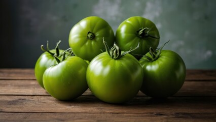 Cluster of green tomatoes on a rustic wooden table