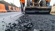 Workers on a road construction, industry and teamwork, new asphalt