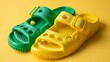 Close-up of foam toddler sandals, featuring fun bright colors such as yellow and green, soft texture highlighted under studio lighting