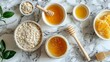 Artistic top shot of natural ingredients for a detox face mask, including honey and oatmeal, on a luxurious marble surface, isolated for clarity