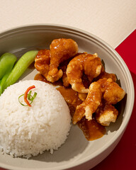 Wall Mural - rice served with flour fried shrimp drizzled with delicious butter sauce