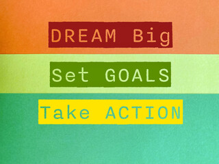 Aspiration Concept - dream big set goals take action text on colorful background. Stock photo.