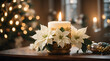 Glowing candle illuminates ornate christmas decoration indoors with white poinsettia