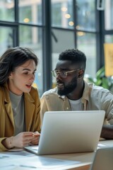 Poster - A man and a woman looking at a laptop screen. Suitable for technology concepts