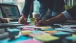 © yusuf - Business people meeting at office writing memos on sticky notes. planning strategy and brainstorming, colleagues thinking concept