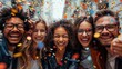 © Hafidhulkarim60 - A happy diverse team of startup business people celebrate their business success amidst confetti