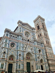 Wall Mural - Florence, Italy - April 10, 2024: Florence cathedral with surrounding area full of tourists in Florence, Italy