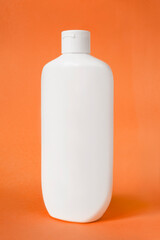 Wall Mural - Shampoo bottle on orange