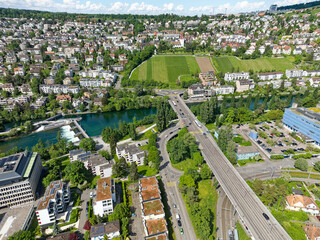 Wall Mural - Aerial view of district Grünau and district Höngg with Limmat River and Europe Bridge at Swiss City of Zürich on a sunny spring afternoon. Photo taken May 14th, 2024, Zurich, Switzerland.