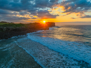 Wall Mural - Aerial sunrise views over Bombo Beach at Kiama