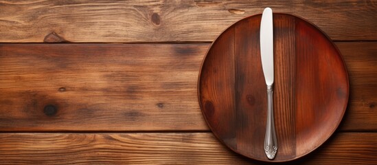 Aufkleber - A wooden texture background with a white plate fork and knife leaving copy space in the image