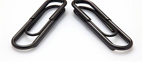 Poster - A copy space image showing three black paper clips placed on a white background