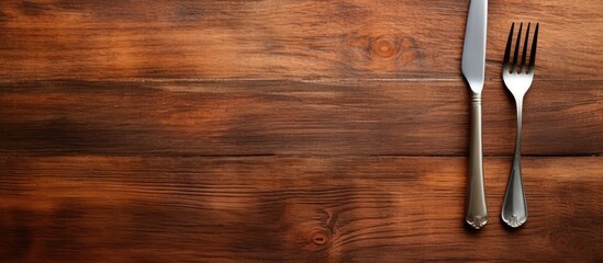 Aufkleber - A wooden texture background with a white plate fork and knife leaving copy space in the image