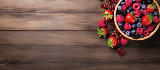 Aufkleber - A top down view of a wooden table showcasing a bowl filled with raspberry smoothie and an assortment of berries leaving space to add text or images. with copy space image