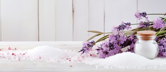 Poster - A copy space image of salt is placed on a white wooden table accompanied by flowers and savory twigs