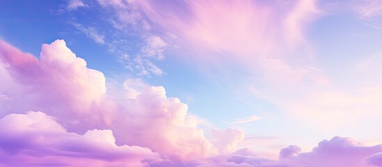 Poster - Soft sky with clouds in hues of pink violet and blue creates a serene and colorful atmosphere for a copy space image