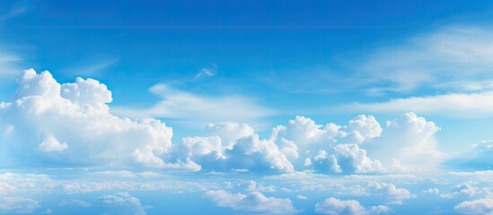 Poster - A scenic outdoor skyline with a vivid cyan cloudscape creating a natural background of blue sky and white clouds Copy space image