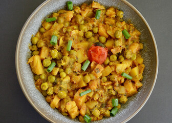 Wall Mural - An Indian style spiced peas and potato dahl with slices of shallot.