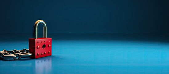 Poster - A safety concept is illustrated with a red chain and padlock against a blue background creating copy space for additional content