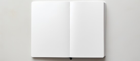 Fototapete - Notebook on white table. copy space available