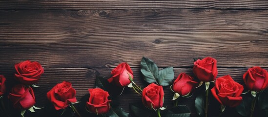 Poster - Red roses flowers on wood vintage photo with copy space overhead