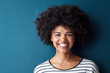 © peopleimages.com - Black woman, portrait and smile with funny, glow and confident on blue studio background. Girl, model and face with afro laughing for joke, comic and happiness or positive with natural beauty
