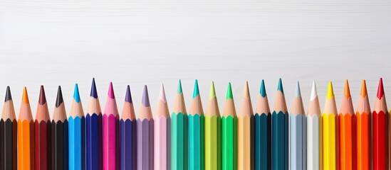 Poster - color pencils on white wood table background. copy space available