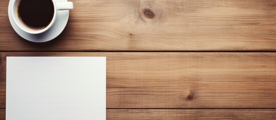 Fototapete - note paper pen a cup of coffee and a smart phone on a wooden table. copy space available