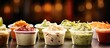 © Gular - A closeup view of a coleslaw and salsa condiment cups in a restaurant or kitchen setting. copy space available